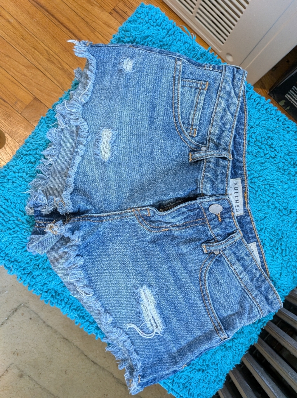 Bullhead Low Rise Frayed Hem Denim Shorts